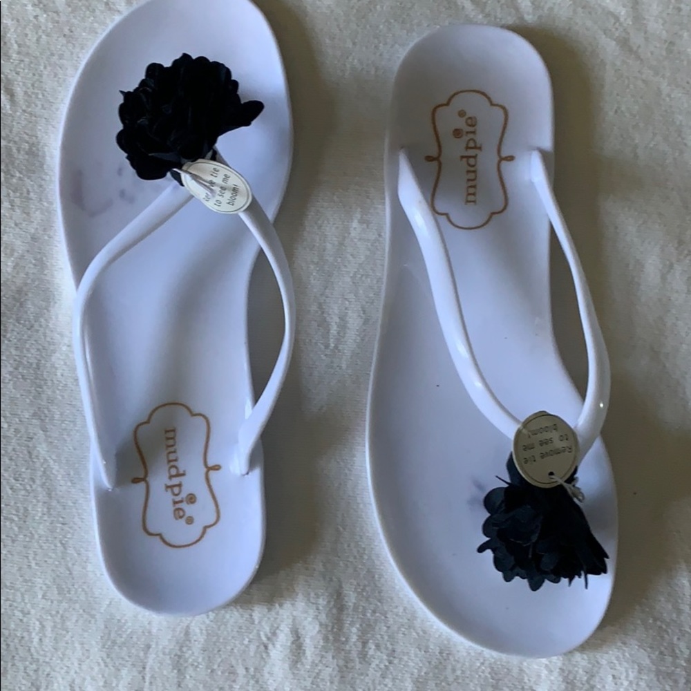 Brand new mud pie flip flops.